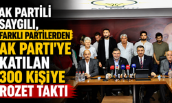AK Partili Saygılı, farklı partilerden AK Parti’ye katılan 300 kişiye rozet taktı